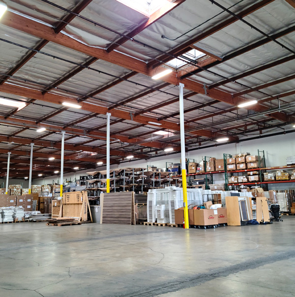 A large warehouse and storage facility with several boxes stacked on shelves.