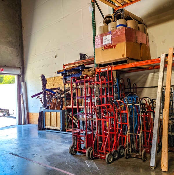 Valley Relocation's Moving Equipment and Material in warehouse ready to go on a move