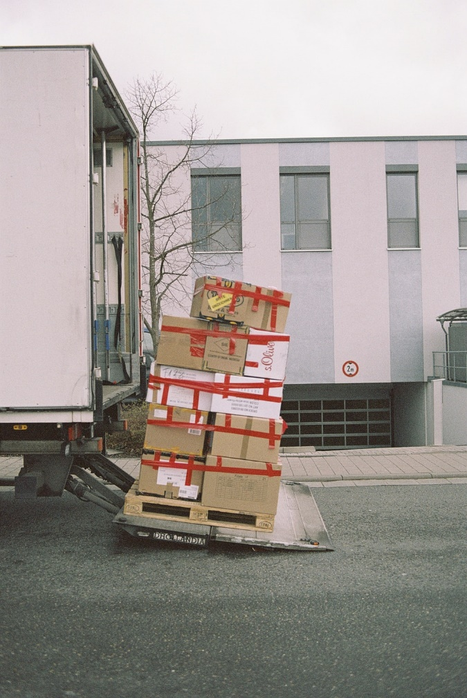 Professionals moving office equipment to new location.