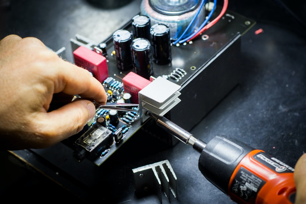 A man from IT data center movers working on IT equipment