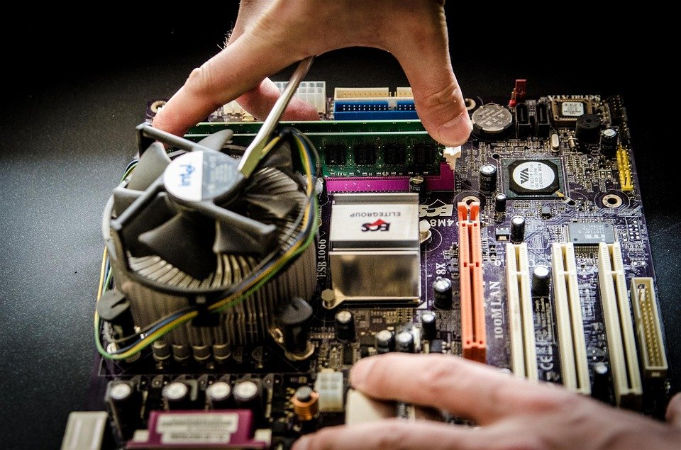 A man from an IT equipment moving company working on a processor