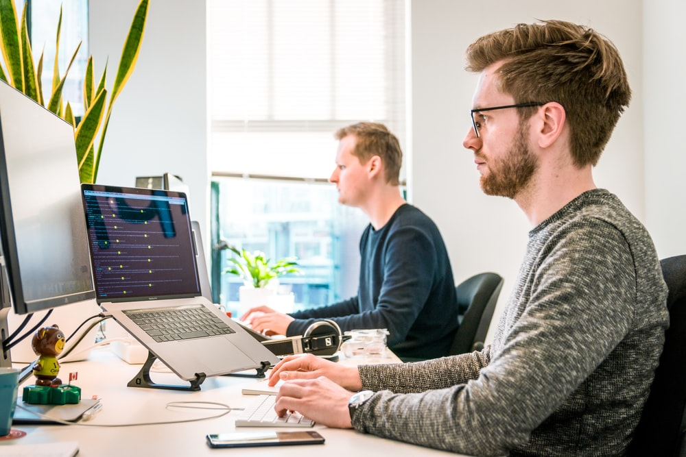 Two men working at an IT office