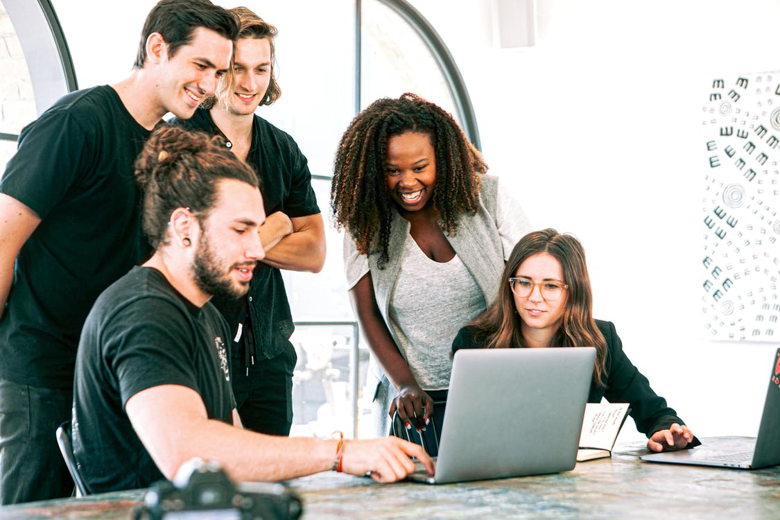 Coworkers discussing something during a meeting