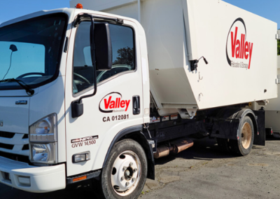 A commercial moving van standard in an empty parking lot.