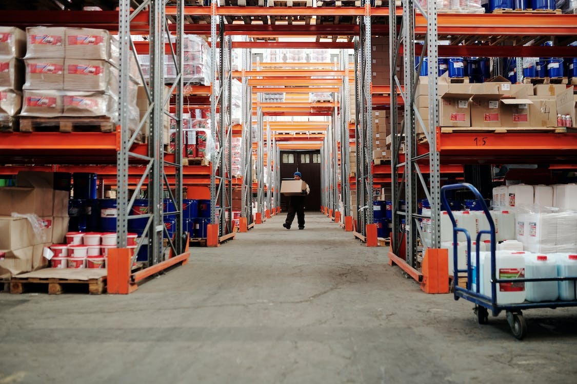 a man taking inventory to place it on a shelf