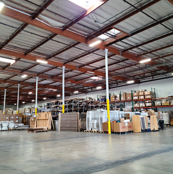 A large storage room with boxes and equipment. 