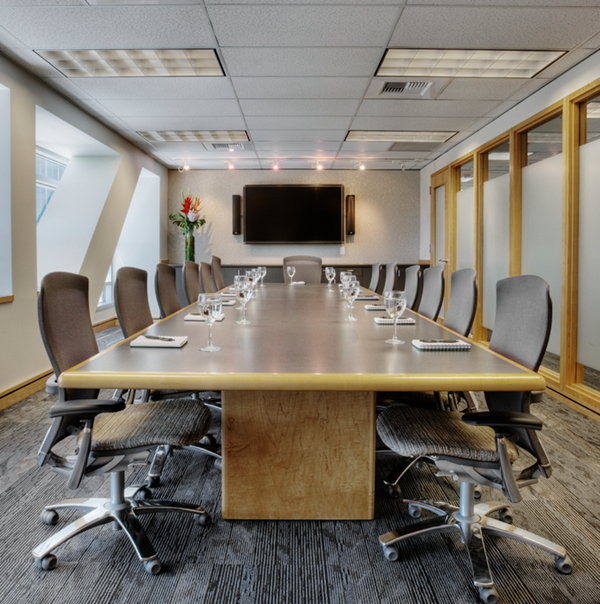 A large conference room with several chairs and other décor. 