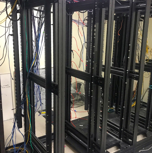 Several pieces of data center relocation equipment are plugged together. 