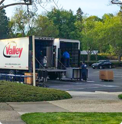 A truck full of professional movers relocating an office. 