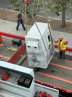 Lifting a large piece of equipment.