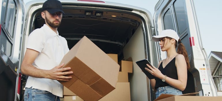 A team from local moving companies Bay Area​ doing inventory of boxes.