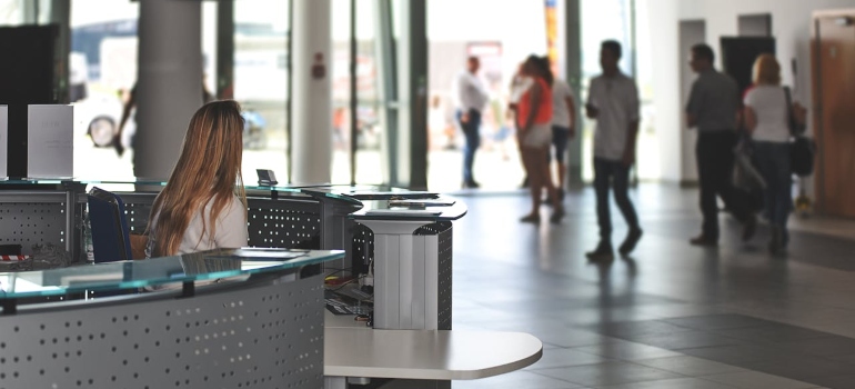 airport desk and a few people around it