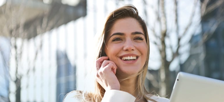 Woman smiling while making a phone call.