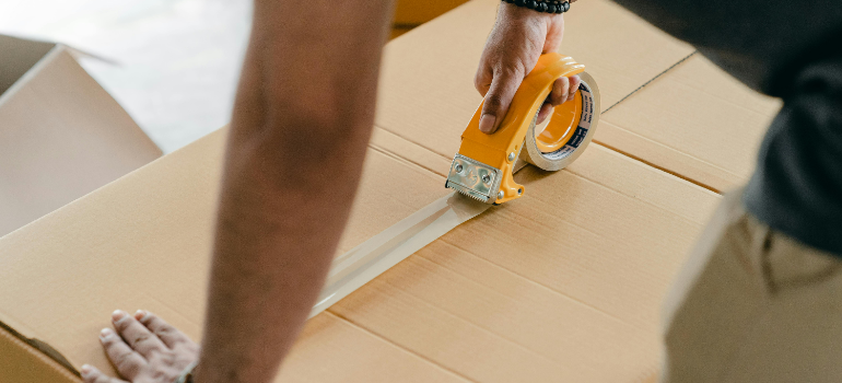 a man packing boxes 