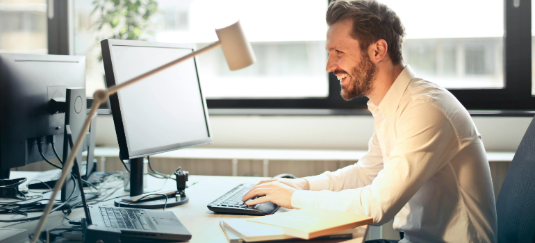 a man at his office searching for office movers in the bay area