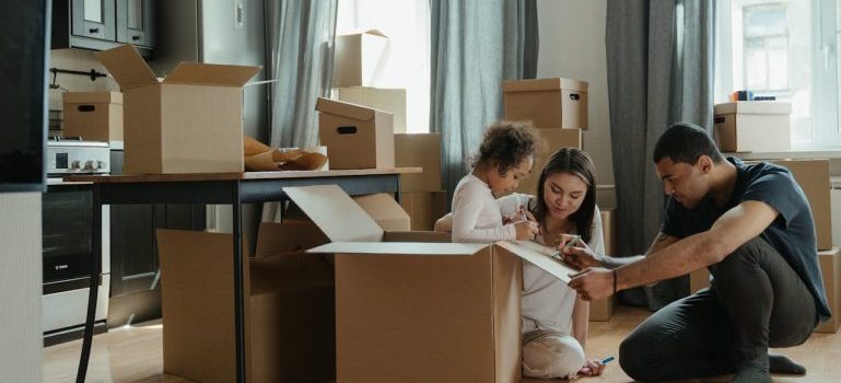 family packing for a move and trying to prevent injuries on a moving day