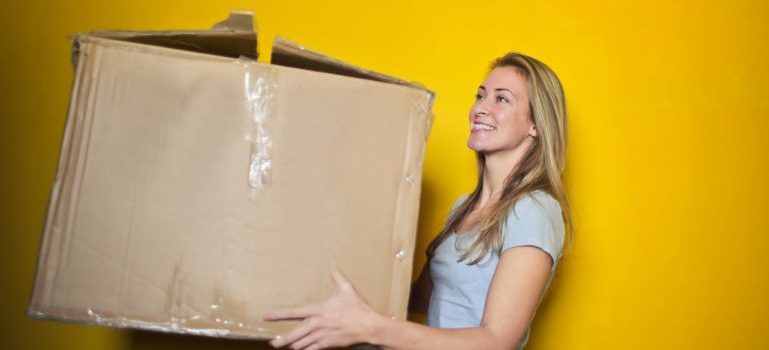 woman holding big box