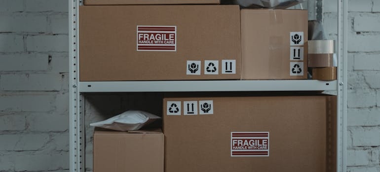 Boxes labeled fragile on a shelf.