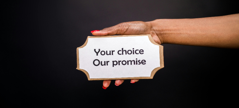 a woman holding a sign