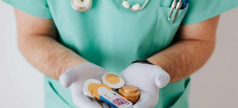 doctor holding money
