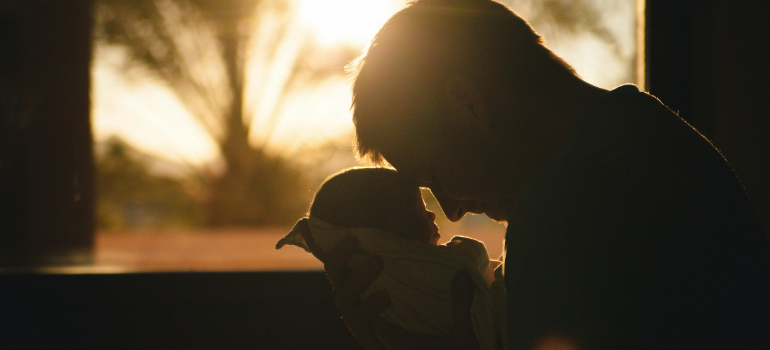 a father and his baby 