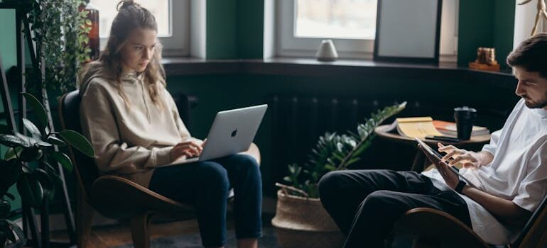Two People Using Their Gadgets