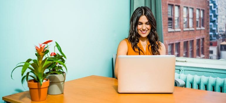 a woman reading about moving tips for remote workers starting over in a new city