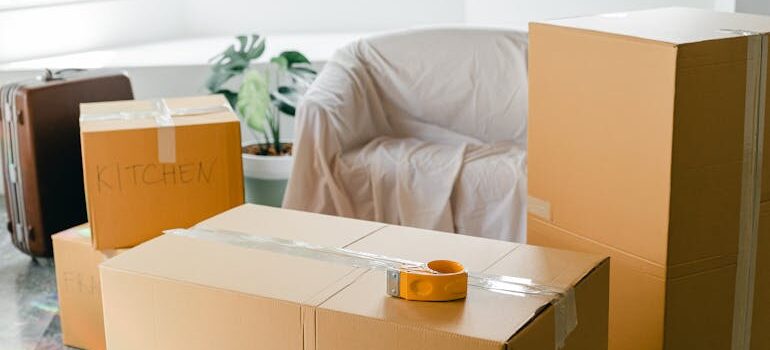 Empty apartment with packed carton boxes