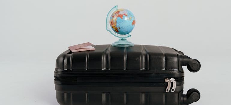 A Desk Globe on a Black Luggage
