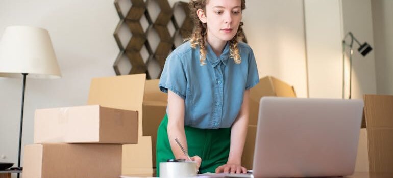  Woman using a Gray Laptop